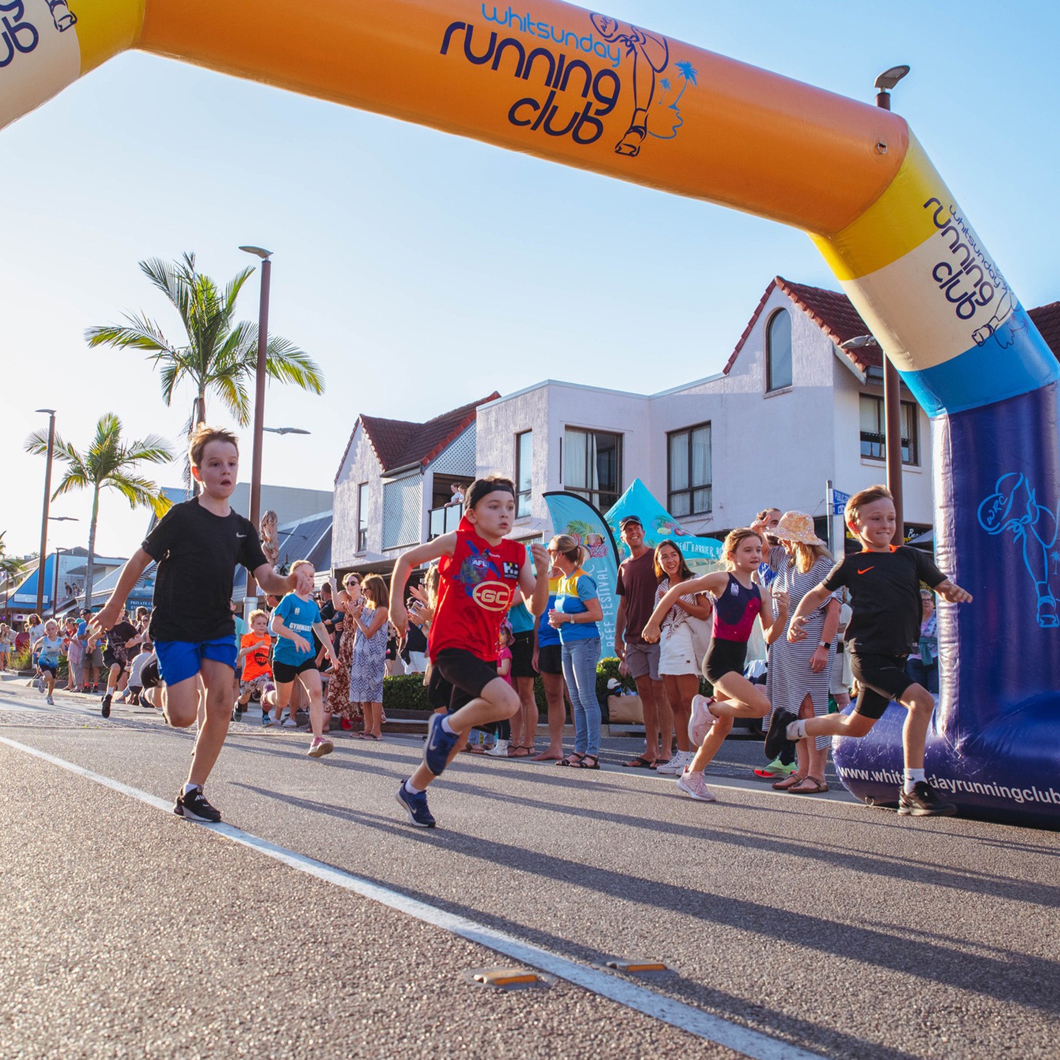 Custom Printed 26' Chamfer Arch Set up for Running Club by Extreme Canopy
