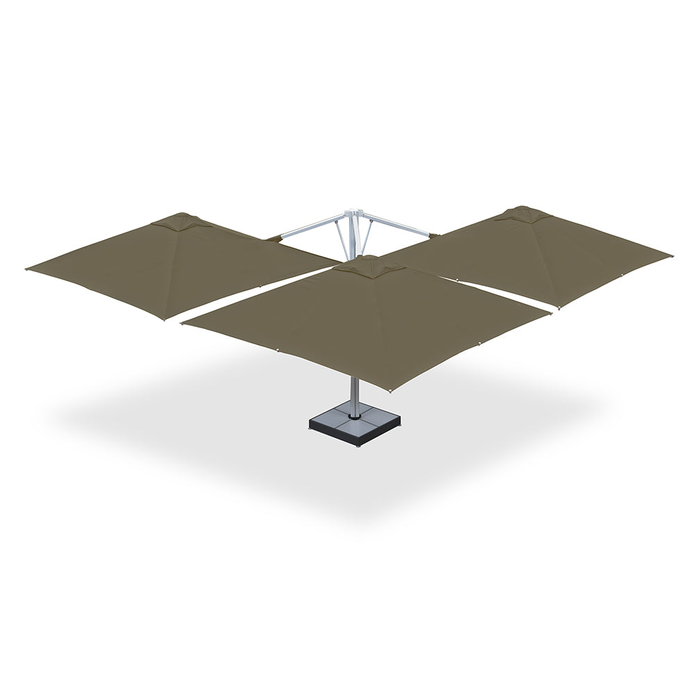 10' x 10' Multi Shade custom cantilever umbrella with three beige pods and a base plate with marble weights