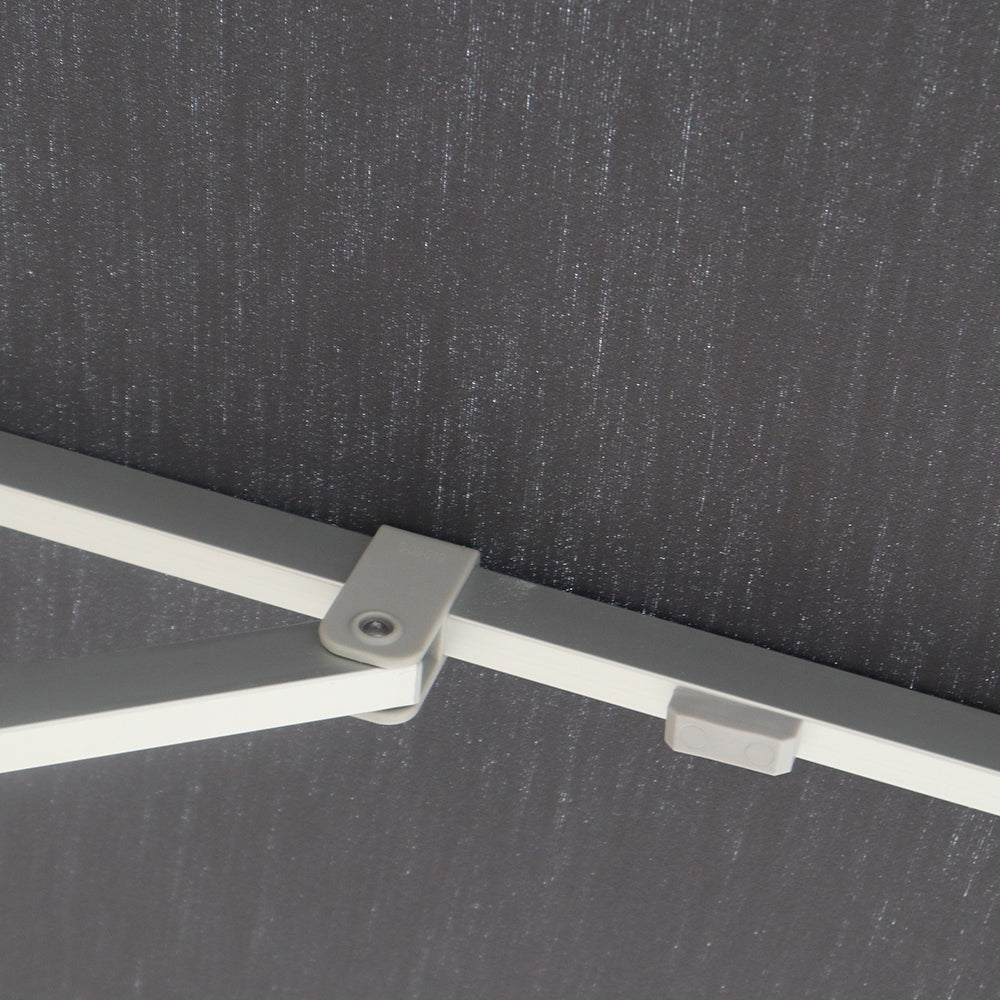 Multi-shade umbrella frame showing a metal support arm and connection bracket beneath the canopy fabric.