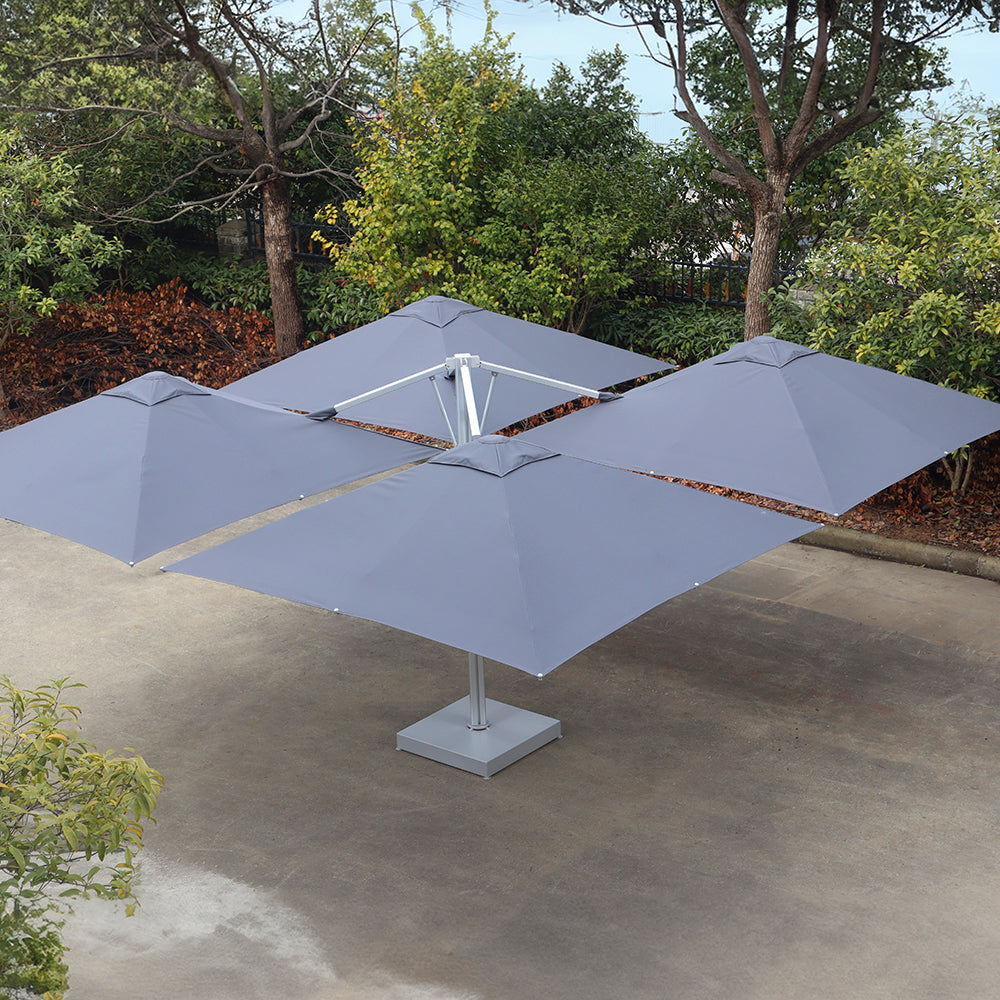 Gray 10x10 ft multi-shade cantilever umbrella with four connected canopies on a single central base