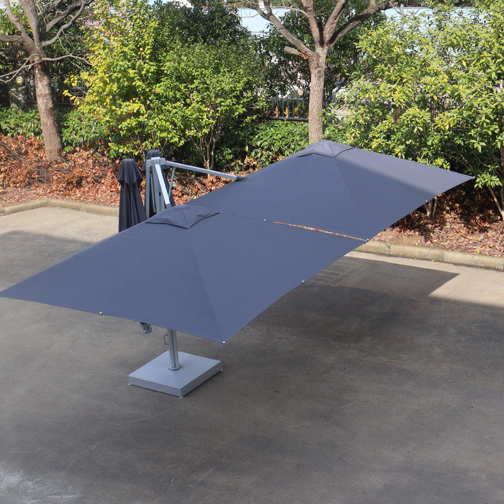 Multi-shade cantilever shade with 2 pods and base pate dynabolts with a square canopy mounted on a central pole base