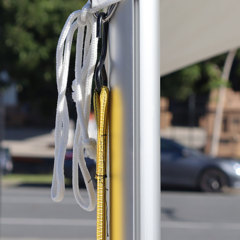 Attach ratchet straps to D-rings on the corner of the roof
